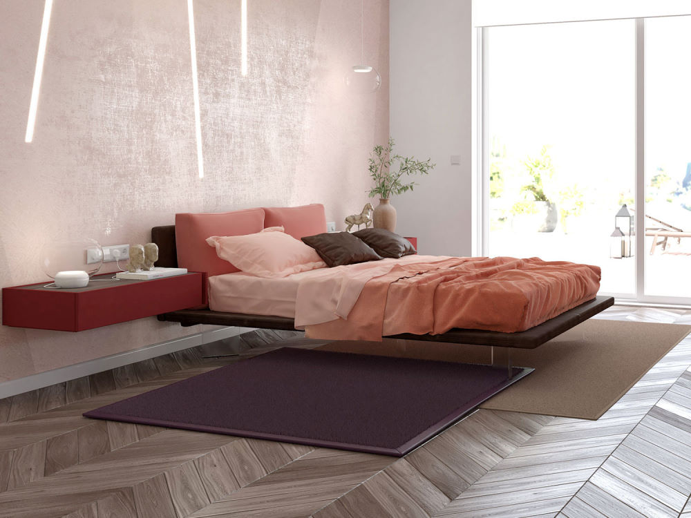 Visuale della camera degli ospiti con letto sospeso e comodini laccati rosso ciliegia