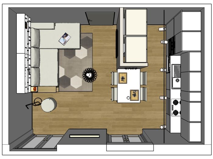 Ambiente unico con cucina e soggiorno con divano tra due muri